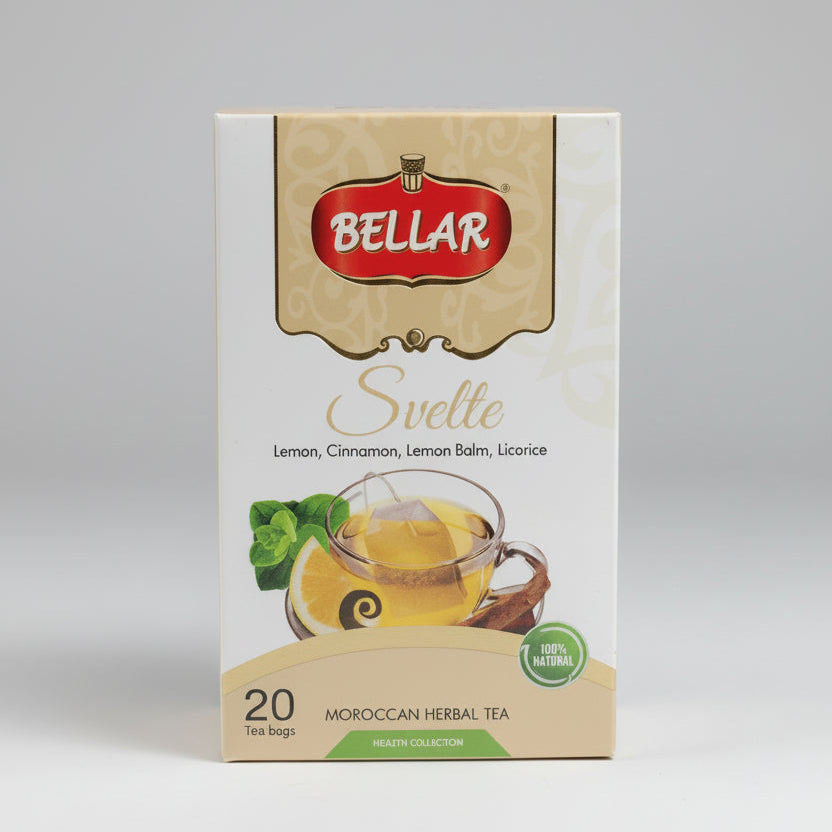 A box of Bellar Svette Moroccan herbal tea, featuring a white and gold package design with an illustration of a glass cup of tea and mint leaves, set on a countertop with a blurred kitchen background.