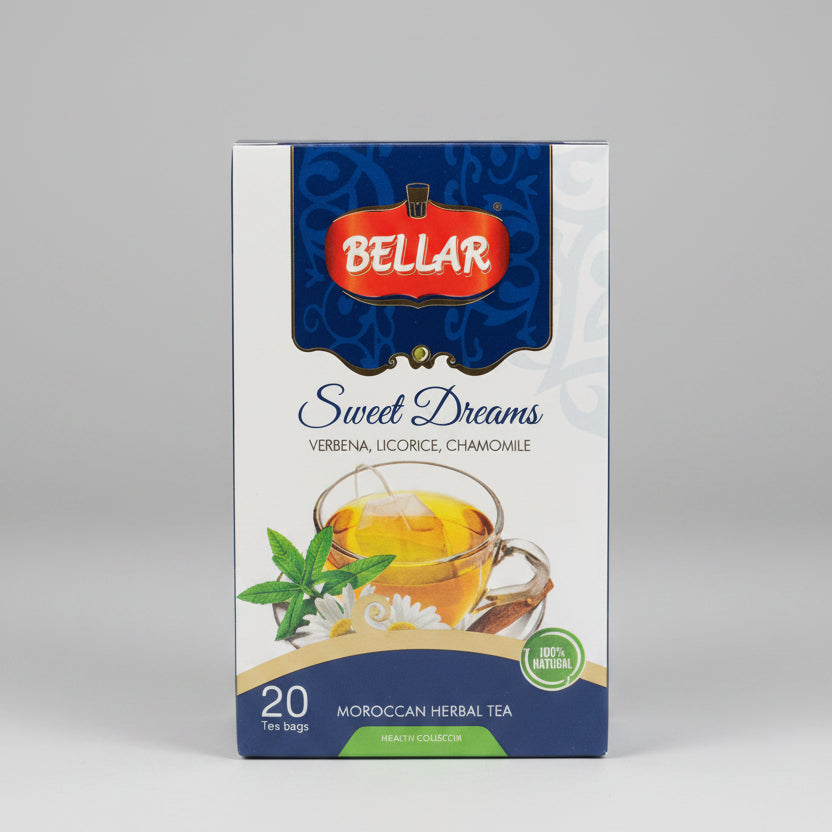 A box of Bellar Sweet Dreams Moroccan Herbal Tea, featuring a white and blue package design with a red Bellar logo, set on a dark metal surface with a blurred kitchen background.