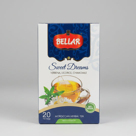 A box of Bellar Sweet Dreams Moroccan Herbal Tea, featuring a white and blue package design with a red Bellar logo, set on a dark metal surface with a blurred kitchen background.